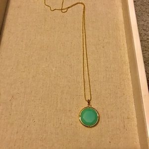 Locket on gold chain with teal stone. New.